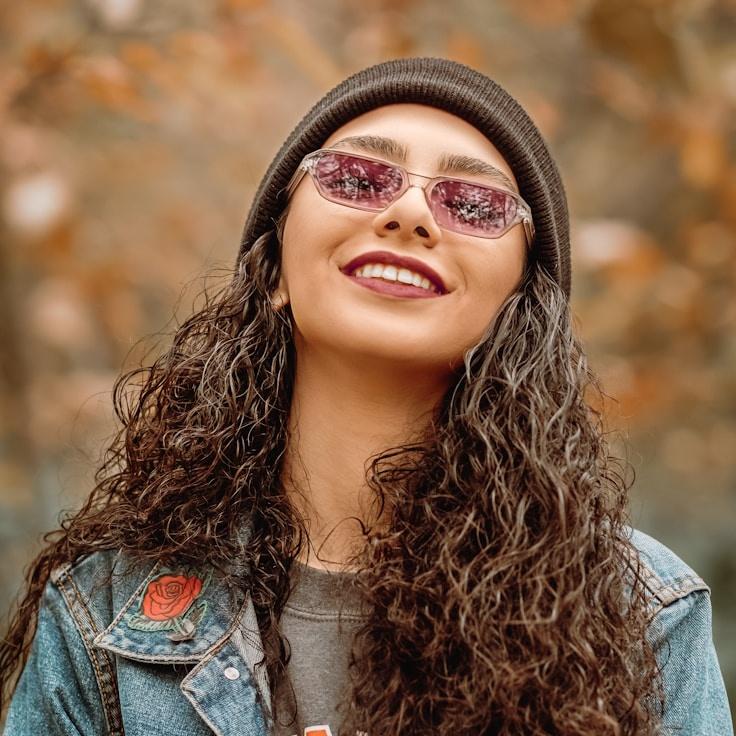 Kaveri Mehta, Lead Design Curator at CycleSailQuiet, reviewing corporate floral arrangements